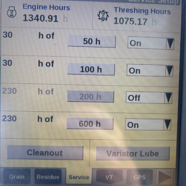 Service setup screen displaying Engine Hours 1340.91 h and Threshing Hours 1075.17 h with adjustable hour presets (50 h and 100 h) and On toggles nearby.