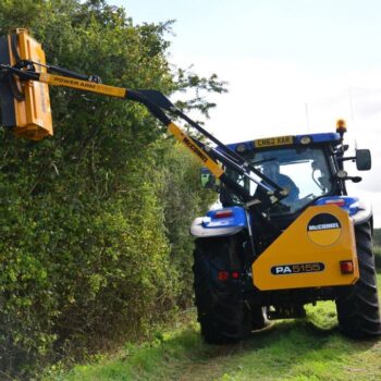 Large Tractor with Mounted Side Arm Flail