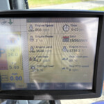 Tractor diagnostic display showing Engine Speed 850 rpm, Time 5:02 pm, Date 15/05/2026, Engine Power 7%.