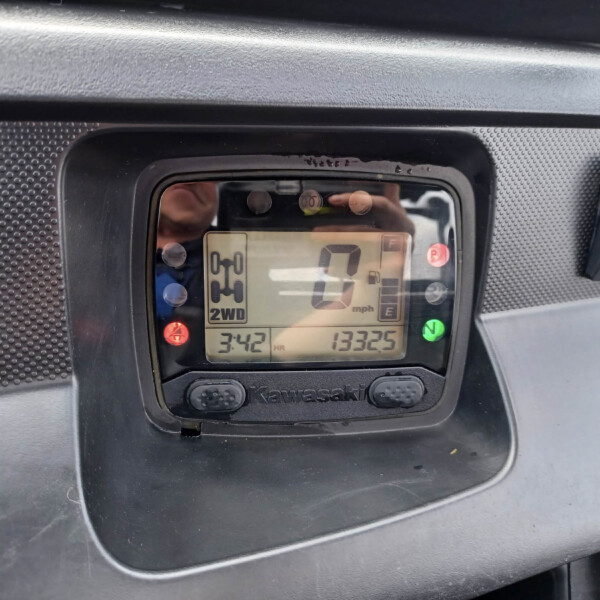 Close-up of a Kawasaki instrument cluster displaying 0 mph, 2WD indicator, time 3:42, and odometer reading 13325 miles.