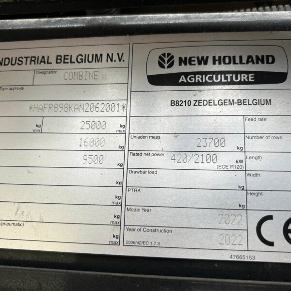 Identification plate with CNH Industrial Belgium and New Holland Agriculture branding on a metal surface