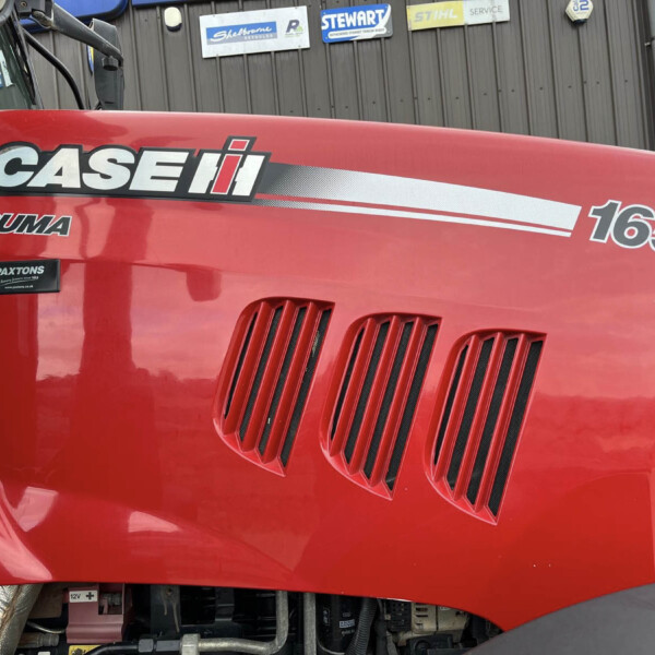 Red tractor hood with CASE logo and 'PUMA' model badge, showing the 165 designation and front grille vents.