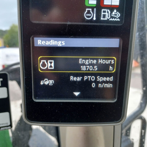 Display panel reading 'Readings' with engine hours 1870.5 h shown on an industrial machine screen in a vehicle cab