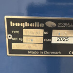 Metal identification plate on a blue surface showing model M35W MT, serial 1855, year 2025, net weight 570 kg; Made in Denmark (Bogballe).