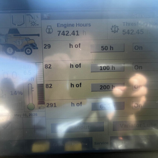 Digital farm monitor showing engine hours 742.41 h and threshing hours 542.45 h, with a combine harvester icon on the left and On toggles on the right.