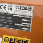 Metal data plate on an orange machine showing CE, UKCA marks, MADE IN ITALY and a BERti logo with model/serial info.