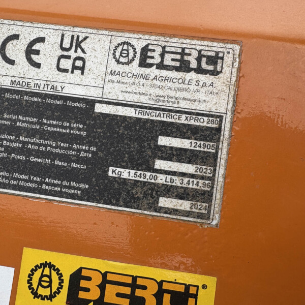 Metal data plate on an orange machine showing CE, UKCA marks, MADE IN ITALY and a BERti logo with model/serial info.