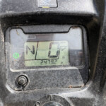 Close-up of a dusty Honda vehicle dashboard, showing the gear indicator in N and a digital odometer reading 2479.2.