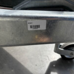 Barcode label on a weathered metal frame showing 'GD105 M' with a printed number 11060662 beneath the barcode.