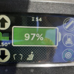 Infotainment screen showing 97% charge with a large up-arrow icon on the left and 5.50 m at the bottom.