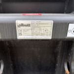 Close-up of a metal data plate on a black frame, listing product SKB220HX, model 2500 Shear King Bucket, serial 65777 and 2.5 m³ capacity (Albutt).