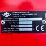 Close-up of a black manufacturer plate on red machinery showing KUHN-AUDUREAU S.A., French address, and a serial/model plate (serial K6618, year 2019).