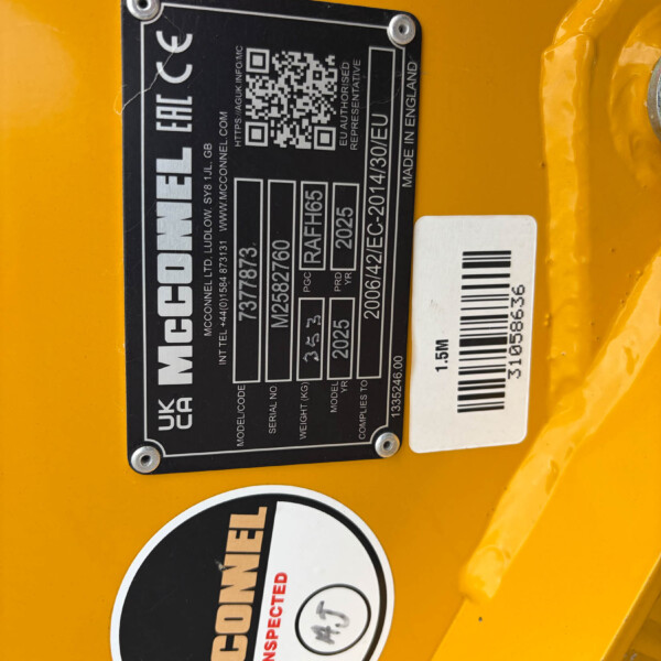 Close-up of a black identification plate with a QR code on yellow equipment; includes Made in England and serial numbers.