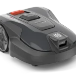 Husqvarna Aspire robotic lawn mower in gray with orange safety lever on top and large rear wheels