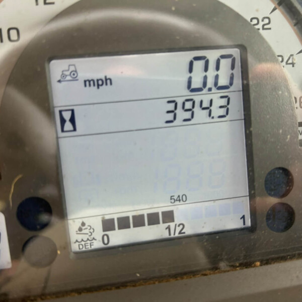 Close-up of a vehicle dashboard showing a digital speed readout of 0.0 mph, with an odometer reading around 3,943 miles and a fuel gauge at half, plus DEF indicator area.