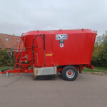Red HiSpec T16 trailer parked on a residential street with hedges and houses in the background