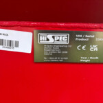 White barcode label with text 'SS1000 MUCK' on a red surface.