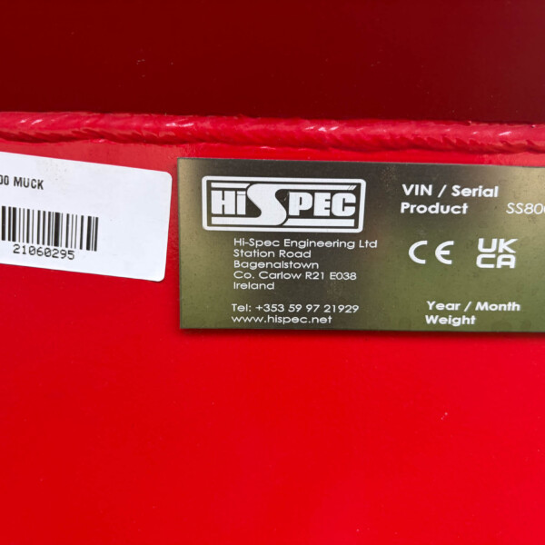 White barcode label with text 'SS1000 MUCK' on a red surface.